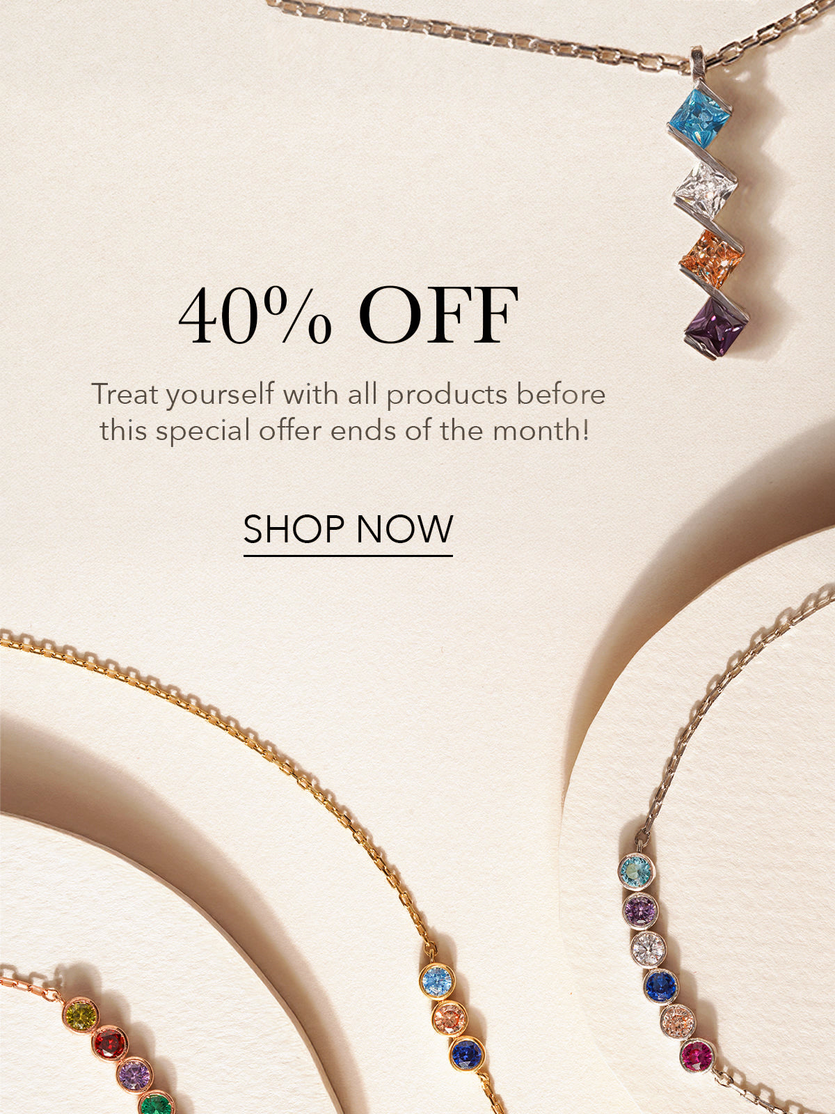 40% off: birthstone bracelets and a gemstone pendant on cream paper
