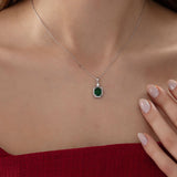 Emerald Cut Emerald Necklace with Diamond in silver, worn