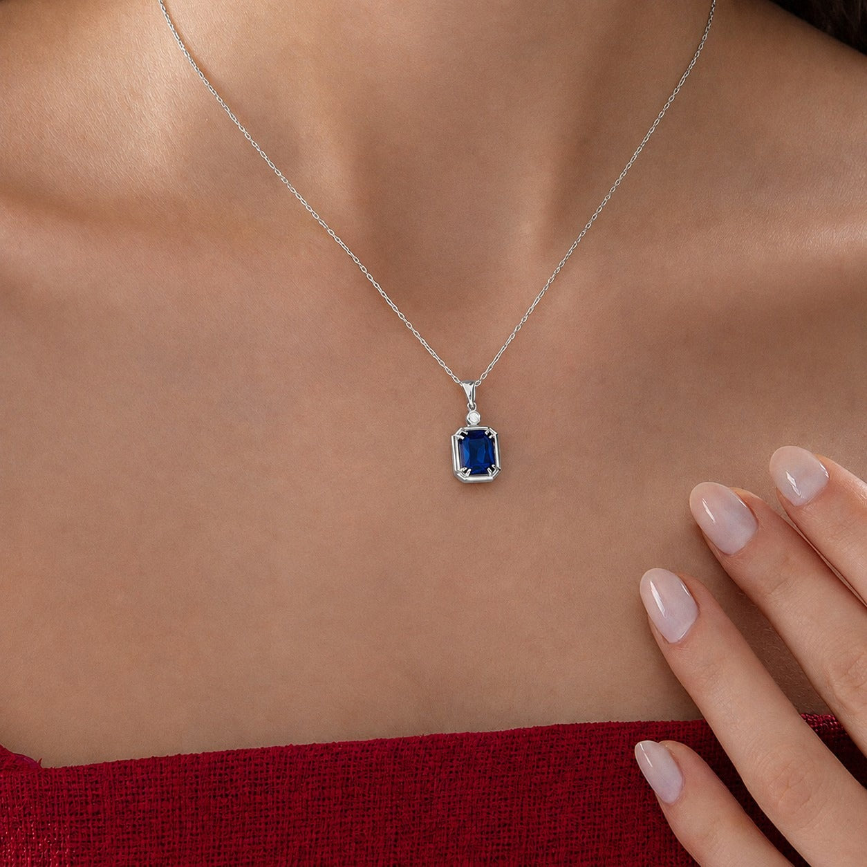 Emerald Cut Sapphire Necklace with Diamond in silver, worn