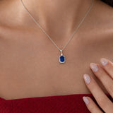 Emerald Cut Sapphire Necklace with Diamond in silver, worn