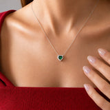 Heart Emerald Halo Necklace in silver, worn