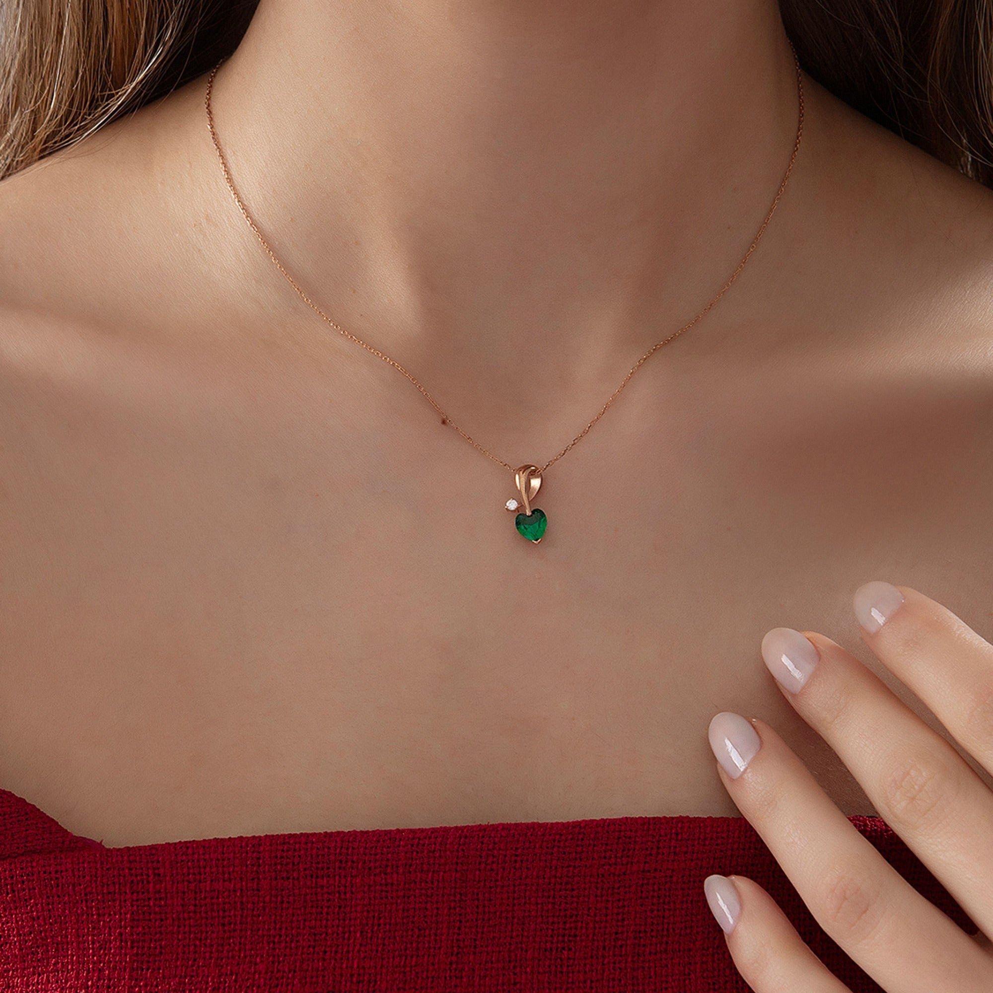 Heart Emerald Necklace with Diamond Swirl in rose gold, worn