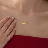 Infinity Necklace with Diamond in gold, worn