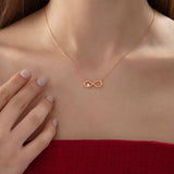 Infinity Necklace with Diamond in rose gold, worn
