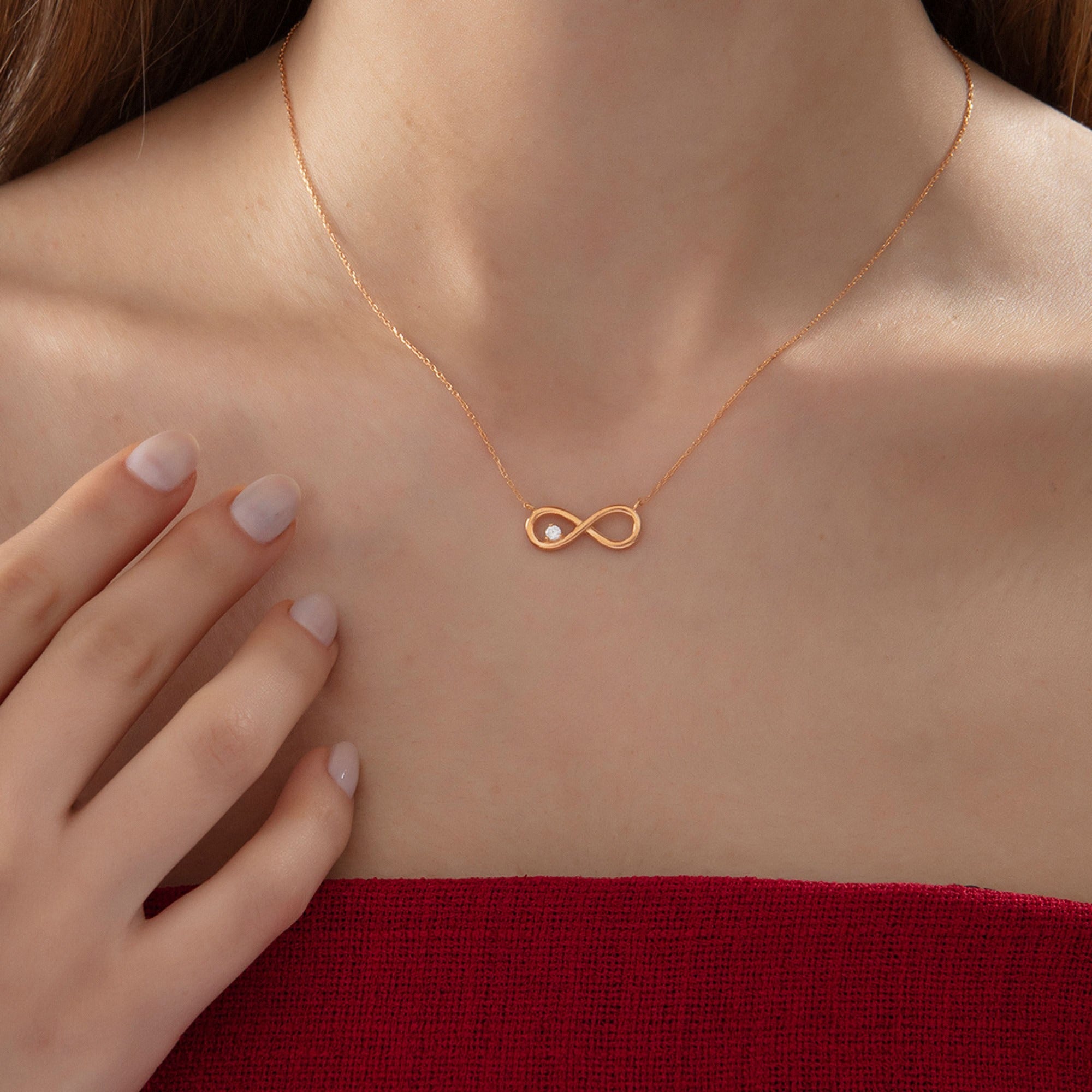 Infinity Necklace with Diamond in rose gold, worn