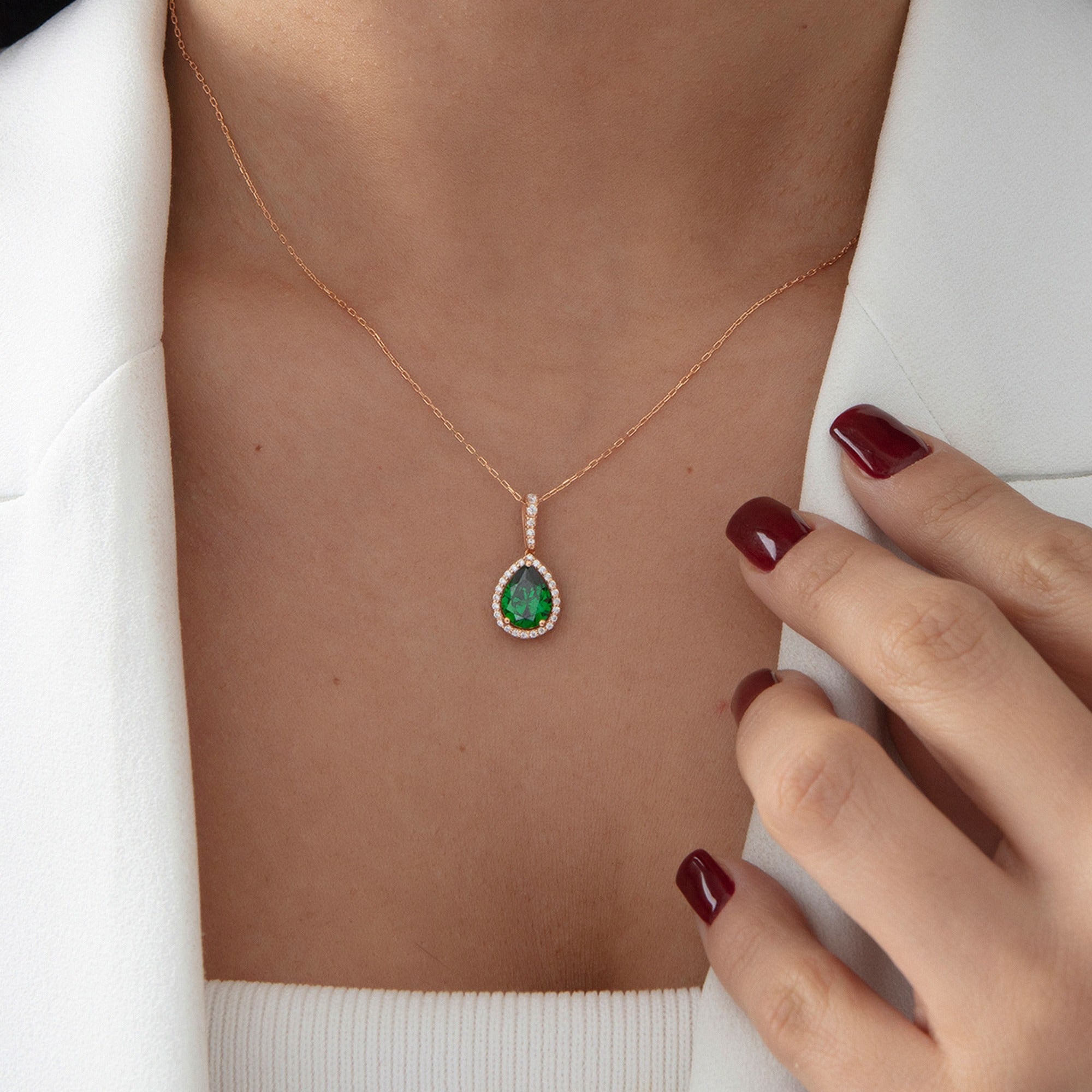Pear Emerald Halo Necklace in rose gold, worn