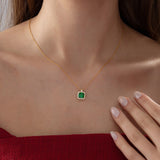 Princess Cut Emerald Halo Necklace in gold, worn